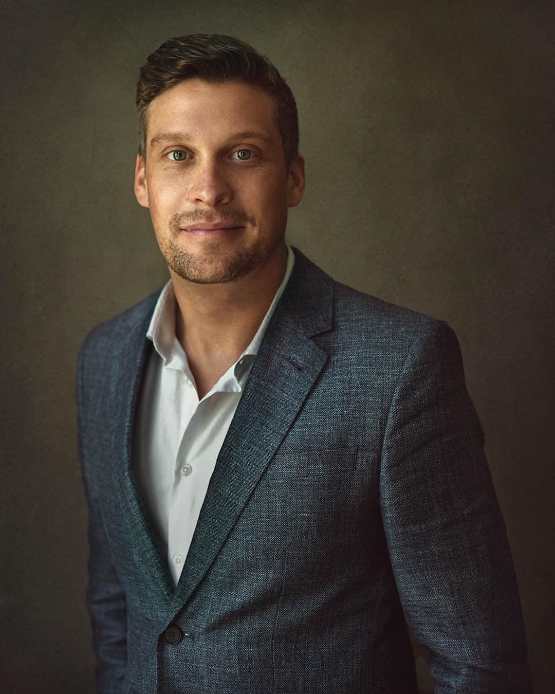 LinkedIn headshot Dubai male professional blue suit portrait